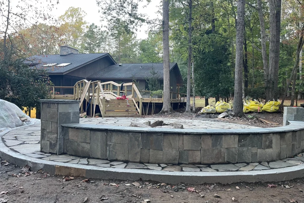 custom flagstone bench with outdoor fireplace by concrete rebirth innovations