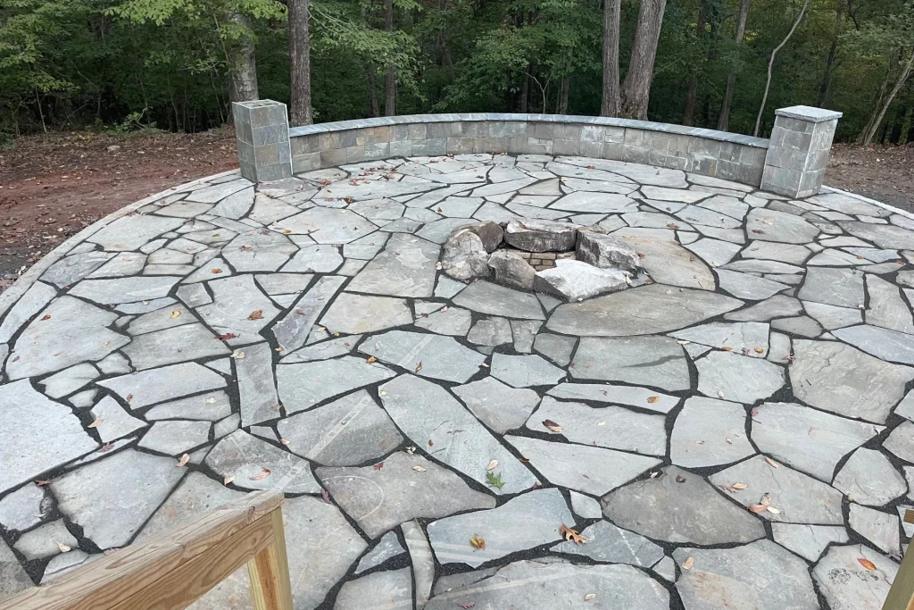 custom flagstone patio with outdoor fireplace by concrete rebirth innovations